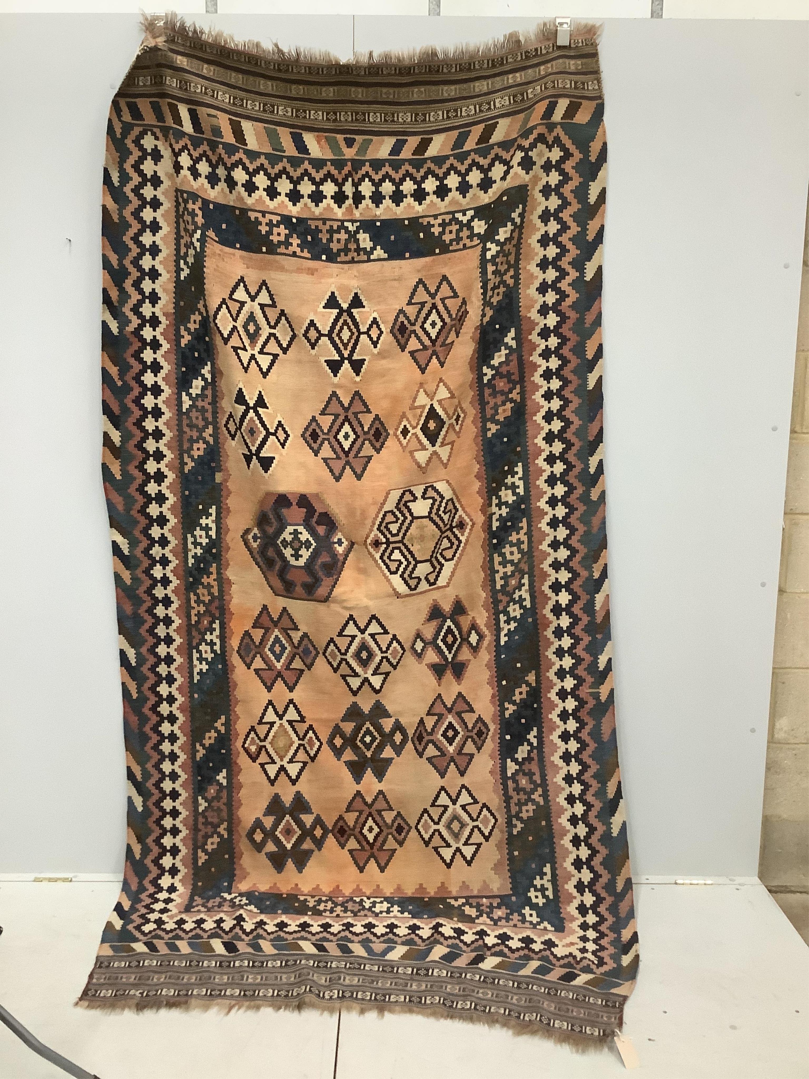 A Kilim polychrome flatweave rug, approximately 280 x 150cm. Condition - fair